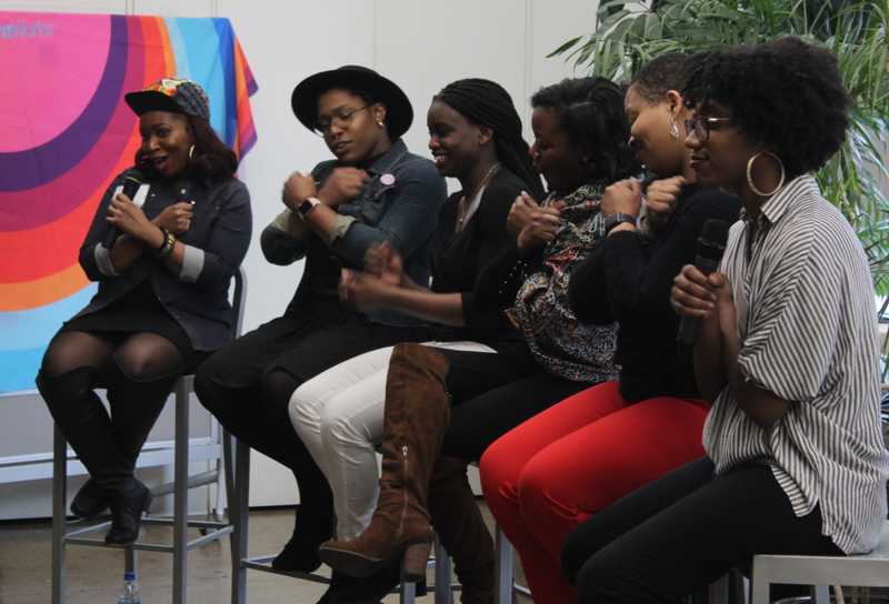 Candid photo of Mavens I/O 2018 panelists with arms crossed in Wakanda pose